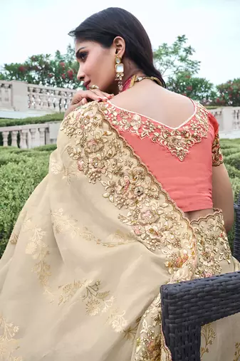 Cream pure tissue silk heavy thread embroidery work on border with zari weaving saree with blouse