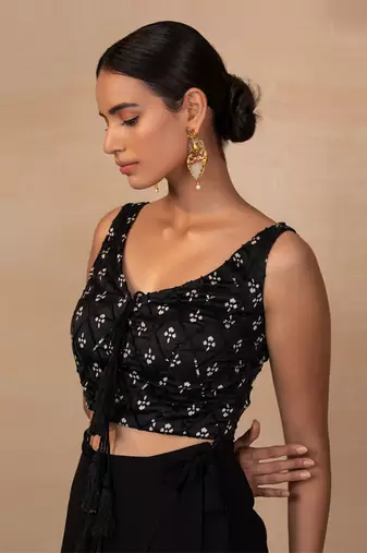 Black top and wrap pants
