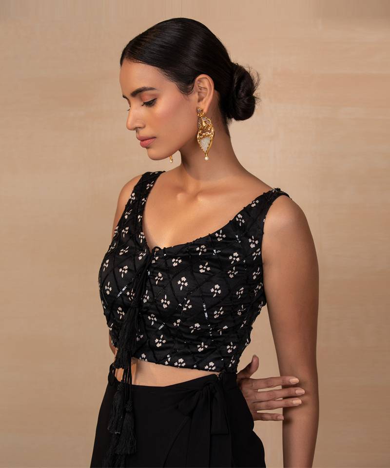 Black top and wrap pants