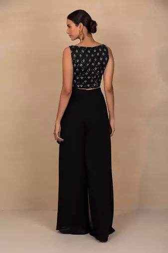 Black top and wrap pants