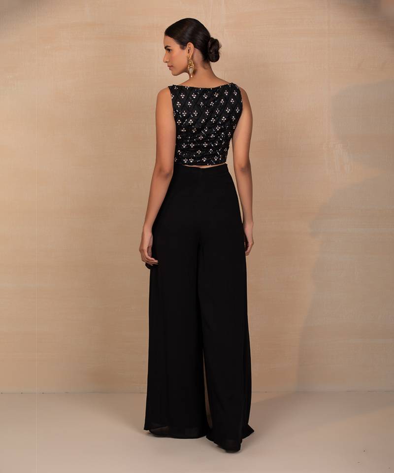 Black top and wrap pants