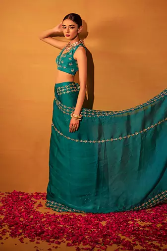 Teal green organza saree