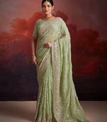 Graceful green organza saree with sequins zarkan