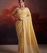 Graceful mustard organza saree with zarkan details