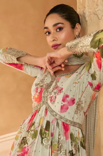 Off white embroidered silk free size stitched gown.(size Free size full stitched Up To 42")