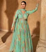 Turquoise embroidered silk free size stitched gown.(size Free size full stitched Up To 42")