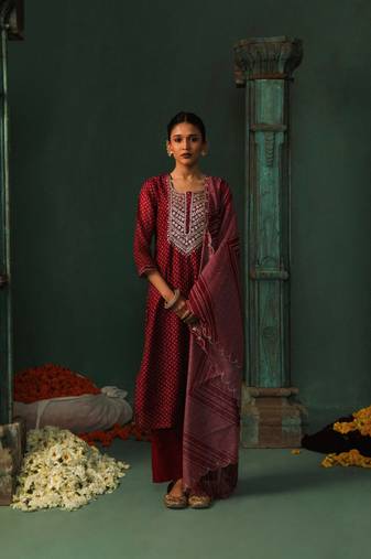 Wine chanderi  embroidery suit set withgotta patti work on neck and scalloped dupatta and mirror work overall