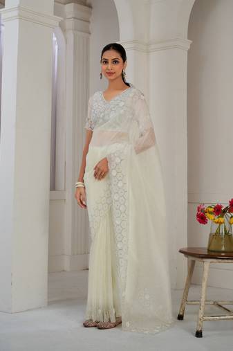 Cream embroidered organza saree with blouse piece