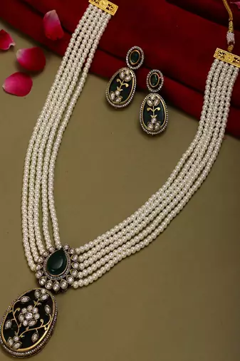Long pearl layered necklace with pendant and matching earrings