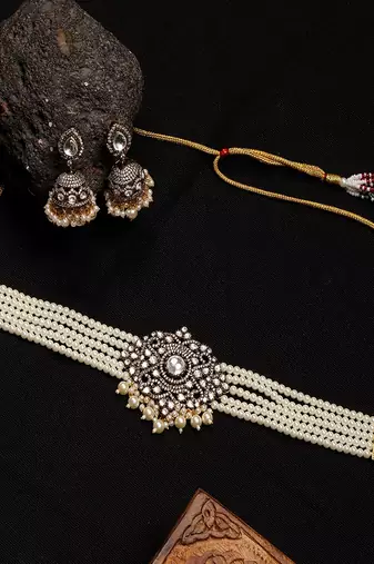 Kundan and mossainite choker in pearls with matching jhumki earrings