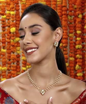 Kundan in pearl string with matching studs 1