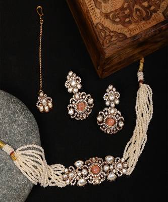 Stone and mossainite kundan in pearls with matching earrings and maang tikka 2