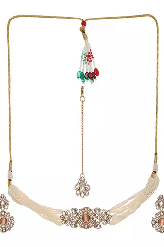 Stone and mossainite kundan in pearls with matching earrings and maang tikka