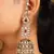 Intricate design jhumkas with american diamonds and pearls