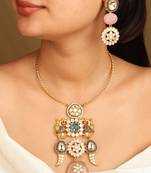 Gold necklace set with stone-studded pendant and matching earrings