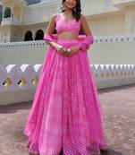 Awesome Pink Laheriya Print Georgette Wedding Wear Lehenga Choli