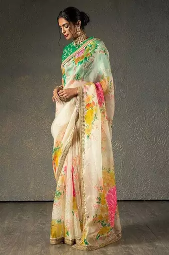 Alluring Cream Floral Orangza Wedding Wear Saree With Blouse