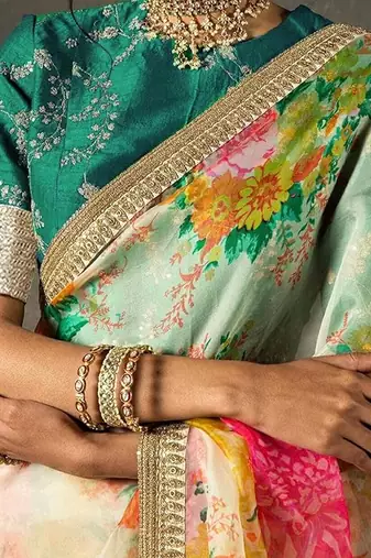 Alluring Cream Floral Orangza Wedding Wear Saree With Blouse