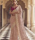 Peach party wear net saree with satin blouse fabric 