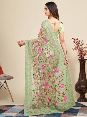 Mint saree with embroidered borders & pink floral patches 2