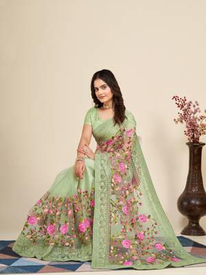 Mint saree with embroidered borders & pink floral patches 4