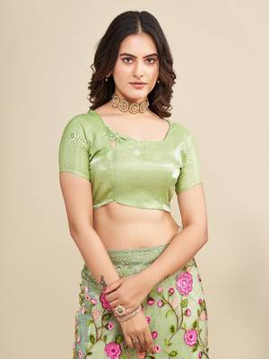 Mint saree with embroidered borders & pink floral patches 5