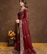 Maroon saree with embroidered border & green blouse