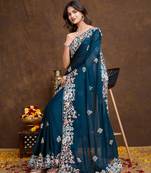 Peacock blue Georgette saree with embroidered border & blouse