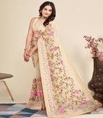 Cream net saree with green & pink threadwork embroidery