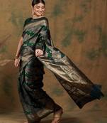 Forest green saree with large zari flower motifs