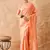 Peach saree with light motifs & zari border