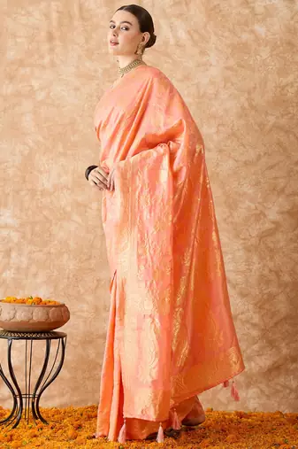 Peach saree with light motifs & zari border