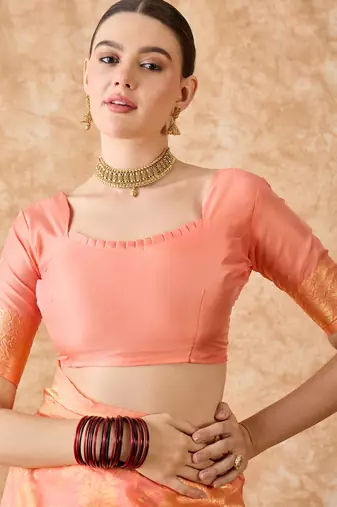 Peach saree with light motifs & zari border