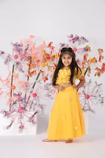 Yellow organza top with puffed sleeves and organza lehenga