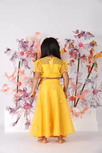 Yellow organza top with puffed sleeves and organza lehenga