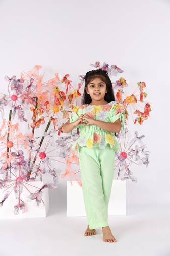 Light green hand embroidered top with drawstring sleeves and green pants