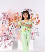 Light green hand embroidered top with drawstring sleeves and green pants