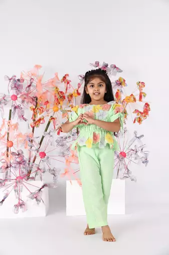 Light green hand embroidered top with drawstring sleeves and green pants