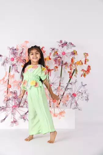 Light green hand embroidered top with drawstring sleeves and green pants
