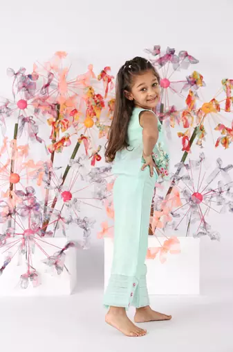 Dark mint sleeveless organza top with pastel floral embroidery and silk pants