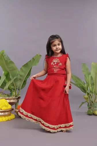 Gold work embroidered silk lehenga and blouse in red