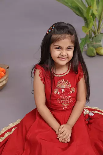 Gold work embroidered silk lehenga and blouse in red