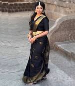 Black saree with gold zari polka dots