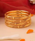Set of 4 gold bangles with cutwork engraving