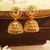 Gold Jhumkas with Intricate Detailing