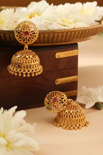 Gold Jhumkas with Pink Stone Accent