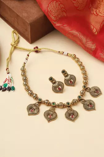 High Gold Necklace with Gold Motifs, Matching Earrings, and Stone Accents