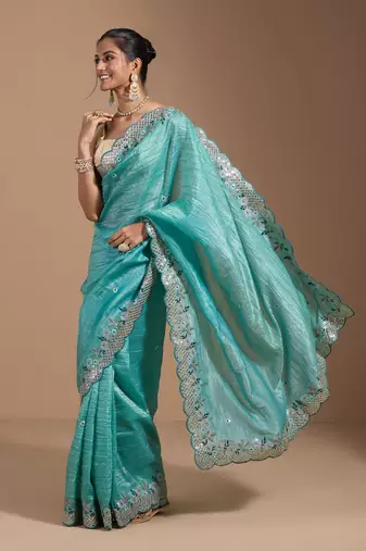 Teal gold crush embroidery & sequence work with all over butta and amazing arc cutting