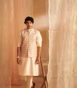 Peach ethnic indian wedding wear kurta payjama with nehru jacket for classy looks