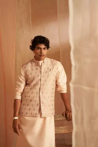 Peach ethnic indian wedding wear kurta payjama with nehru jacket for classy looks